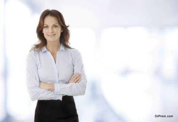 Beautiful modern businesswoman standing in her office.