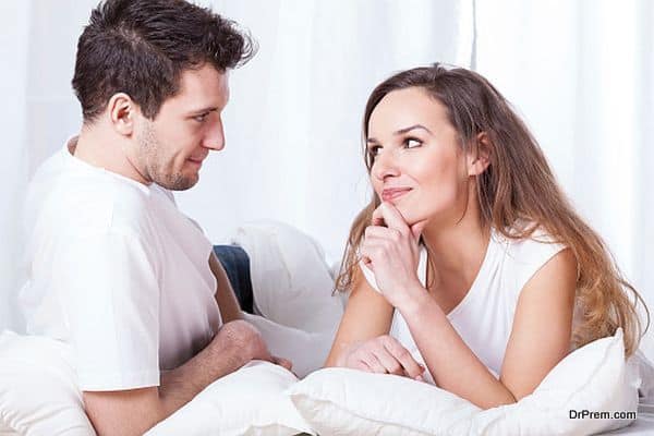 Couple contemplating in bed