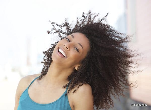 Cheerful young african american woman smiling