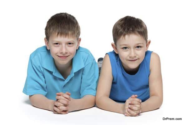 Young boys together on the white background
