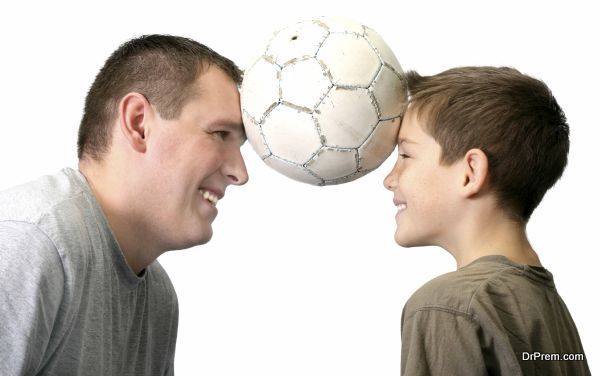father and son with football