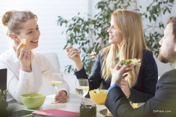 Young people eating lunch in office