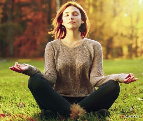 Beautiful young girl meditating