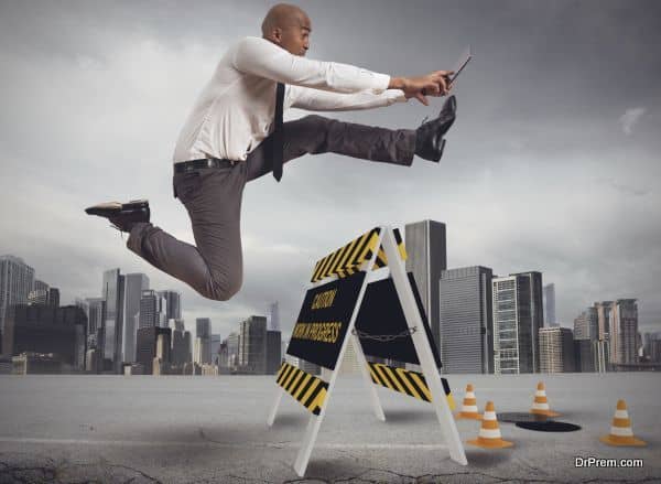 Businessman distracted trying to overcome a hazard