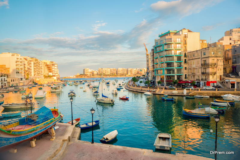 Beautiful view of harbor with maltese yachts and boats in St. Julians to Sliema, Spinola Bay, Malta