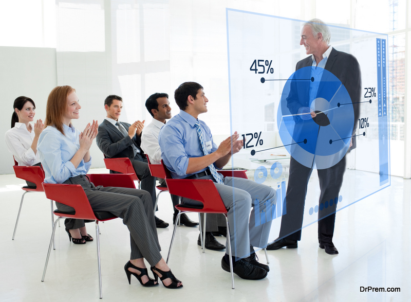 Business people clapping stakeholder standing in front of blue pie chart interface