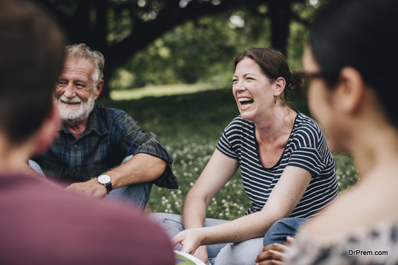 Cheerful woman in the park with her friends