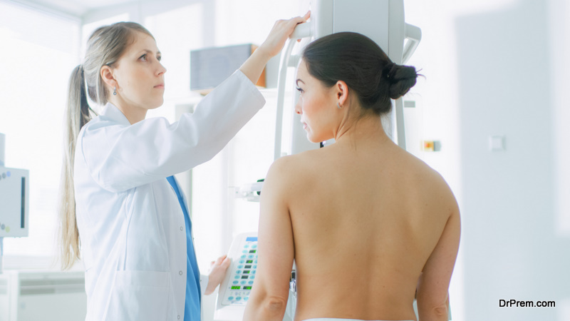 Doctor adjusts Mammogram Machine for a Female Patient Breast Cancer Prevention Screening