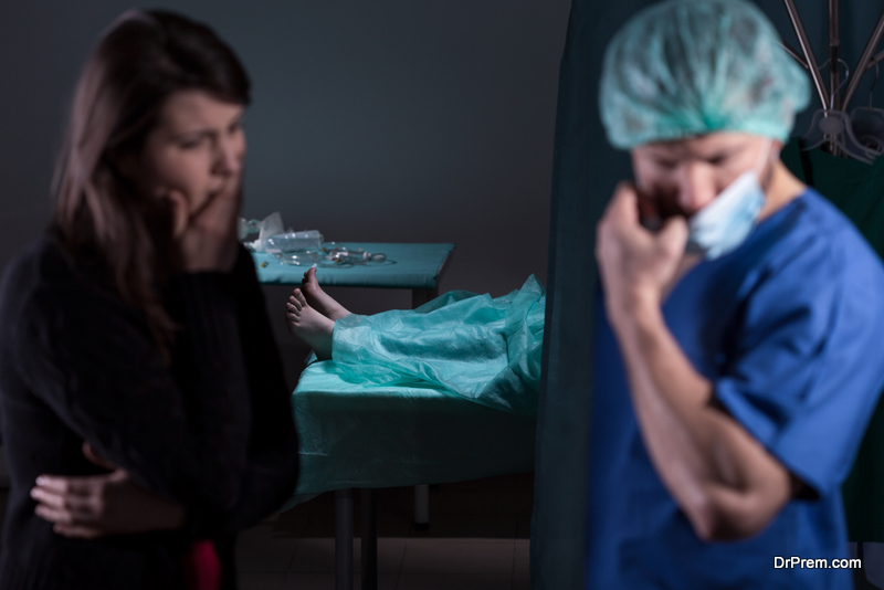 Doctor after unsuccessful surgery talking with patient's family member