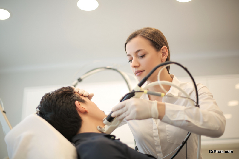 Doctor doing a dermatology treatment on a patient