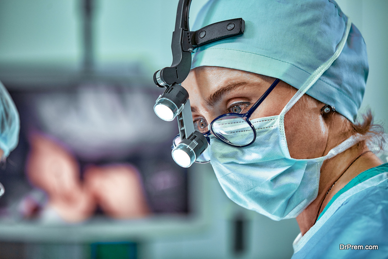 Female surgeon in operation room with reflection in glasses,