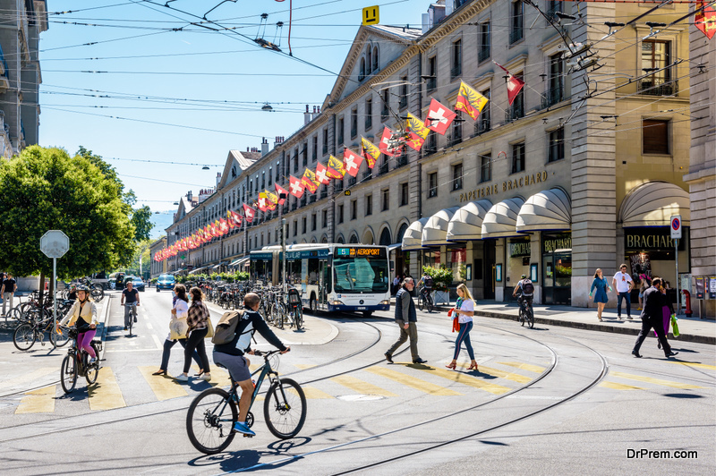 Geneva, Switzerland - Pedestrians and cyclists are crossing 