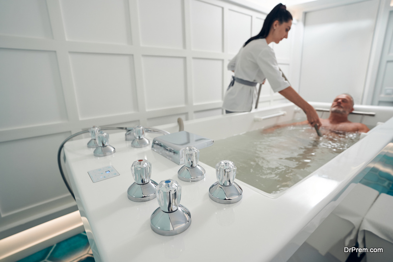 Man having hydrotherapy procedure at wellness center