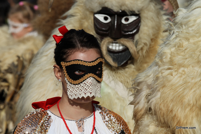 Masked girl during the Busojaras annual carnival in Hungarian town of Mohacs