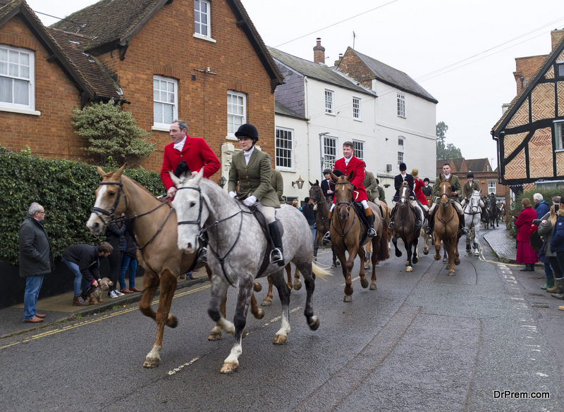 Men and women on horseback in a fox hunt on Boxing Day, England