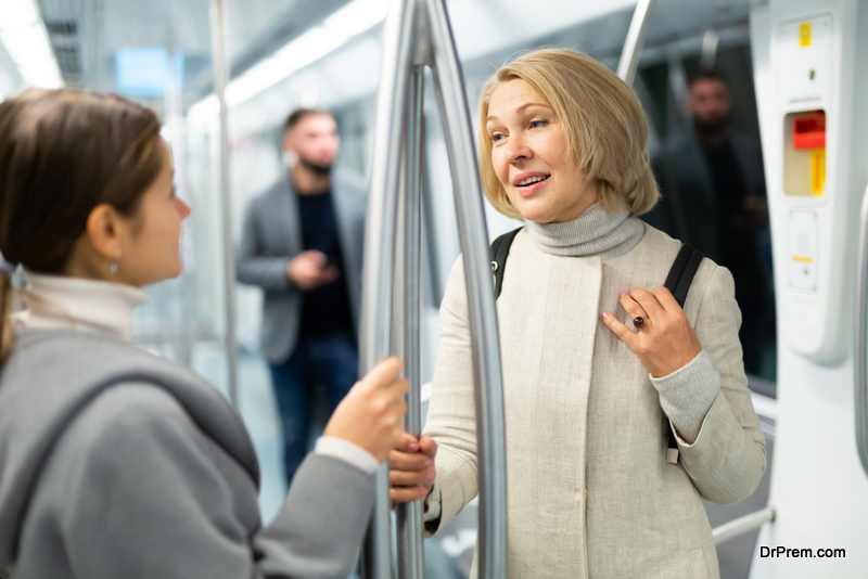 Two women passengers talking