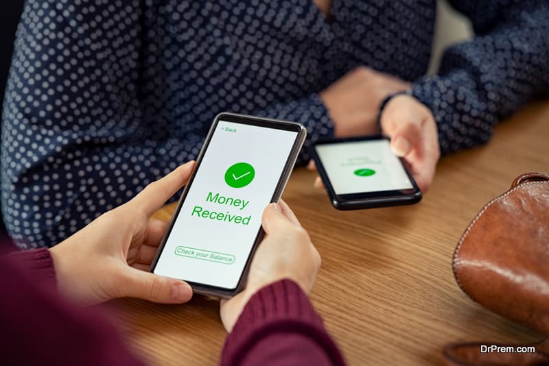 Woman receiving digital money using phone