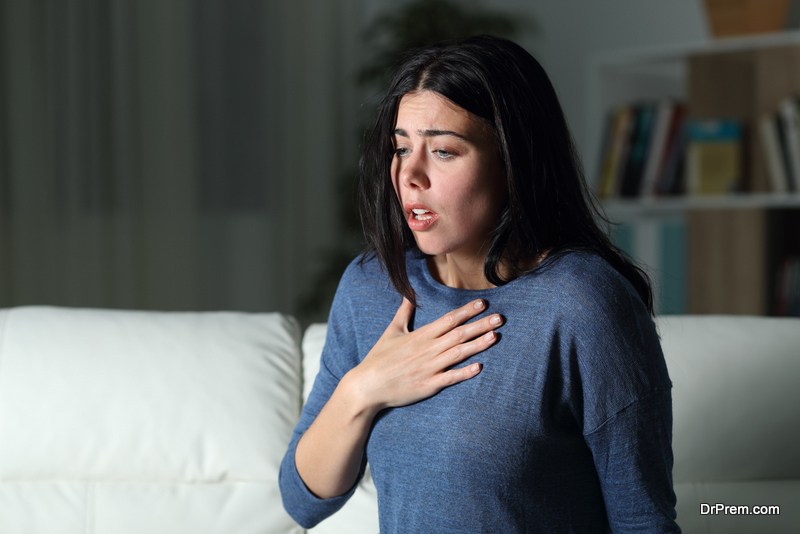 Woman suffering an anxiety attack alone in the night