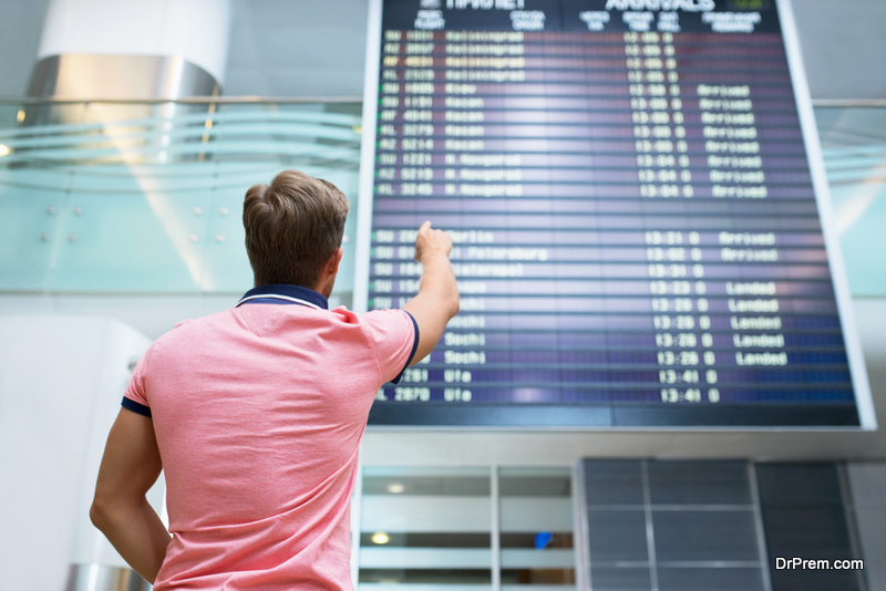 Young man with a passport at the board