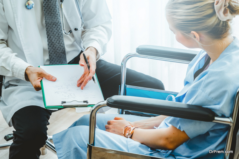 Doctor in professional uniform examining patient at hospital