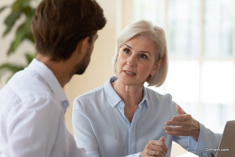  two persons discussing ideas 