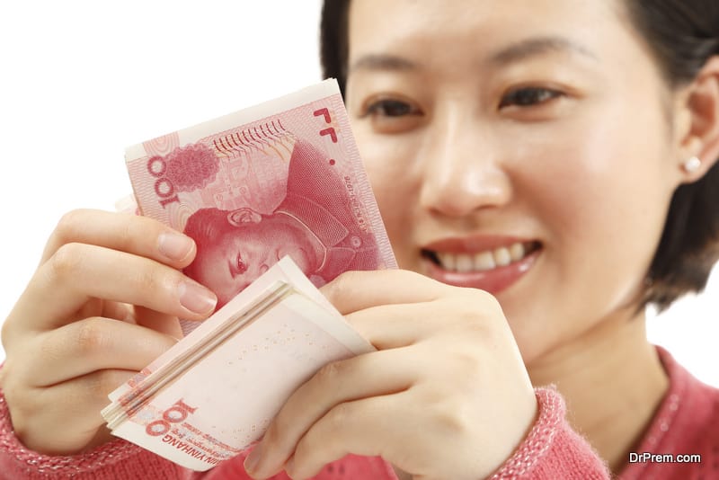 Woman counting Chinese currency