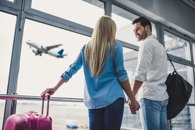  Attractive young woman and handsome man with suitcases are ready for traveling