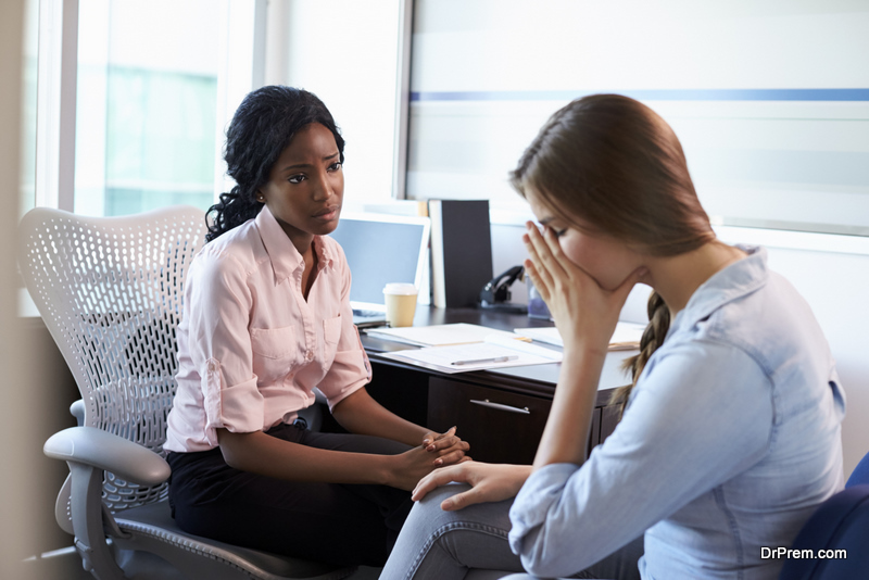 Doctor In Consultation With Depressed Female Patient 