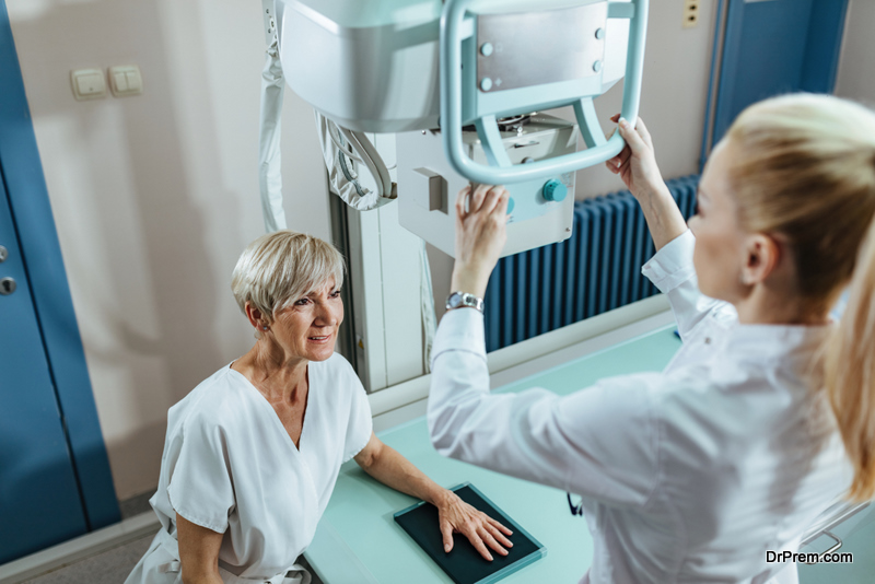 Senior woman undergoing for hand X-ray in the hospital