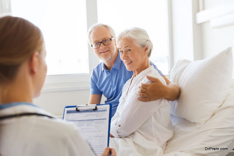 senior woman, man and doctor with clipboard at hospital ward