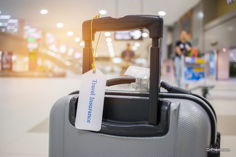 Travel-Insurance-tag-on-suitcase-holder-with-tag