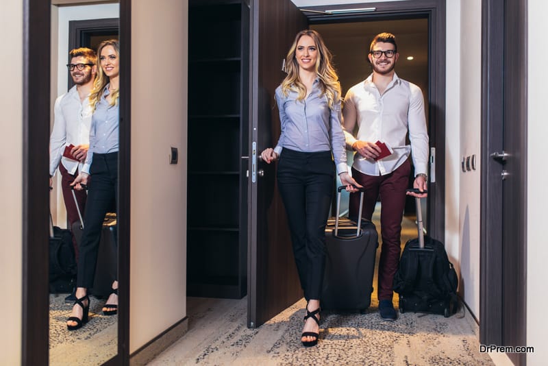  Young couple entering the hotel room together