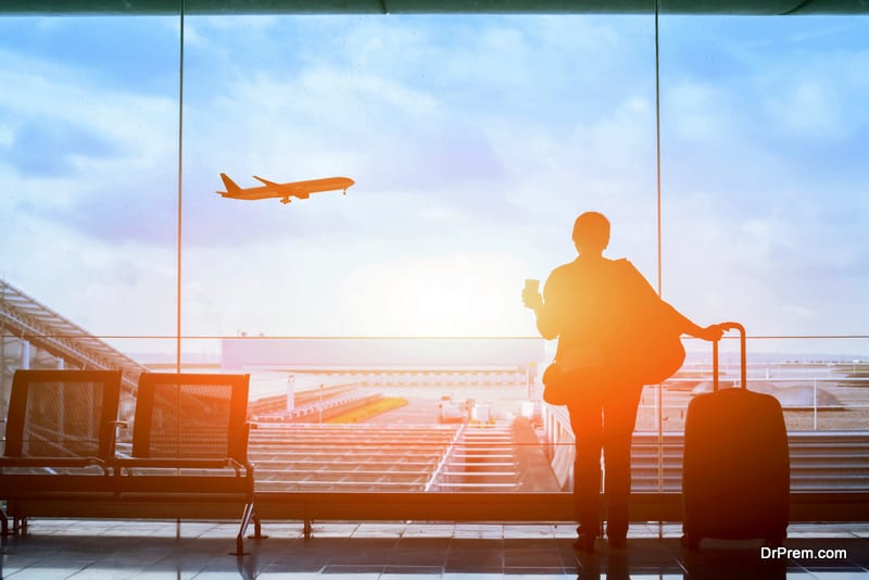 happy traveler waiting for the flight in airport, departure terminal, immigration concept