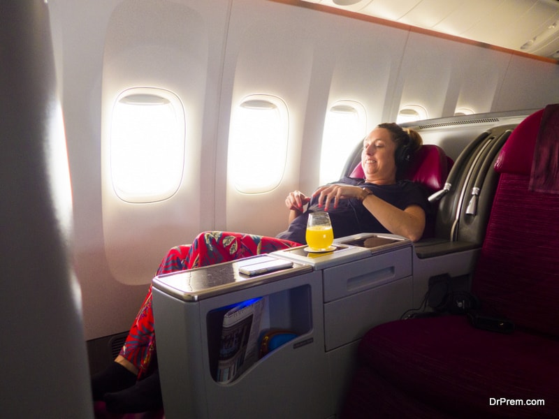 woman flying in business class