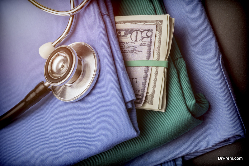 Wad of money American dollar in nursing clothes, stethoscope on nursing clothes
