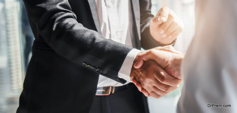 Business background of businessman having handshake