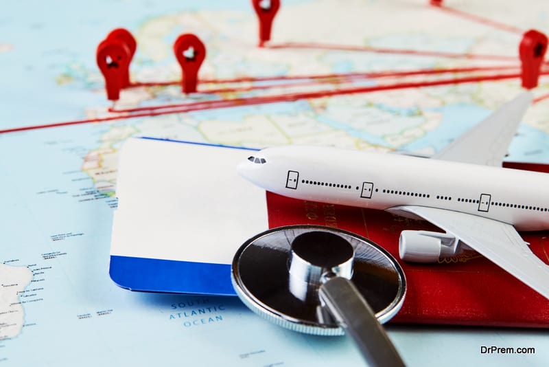 Medical travel concept with stethoscope passport document and airplane on world map background.