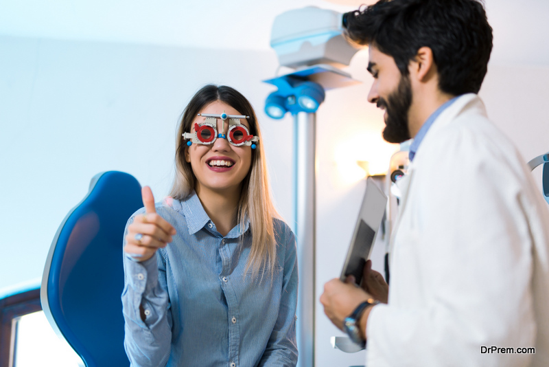 Optometrist checking patient eyesight and vision correction