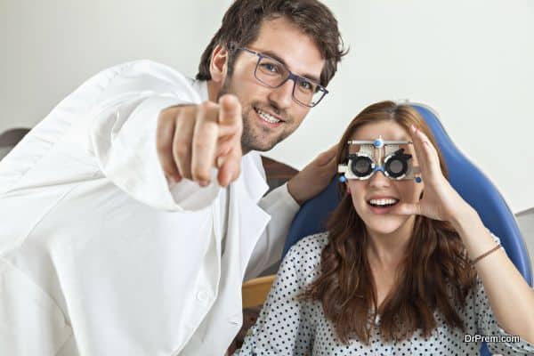 Optometrist Giving Young Woman An Eye Examination