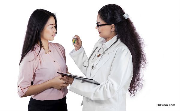 Indian doctor giving drugs to patient