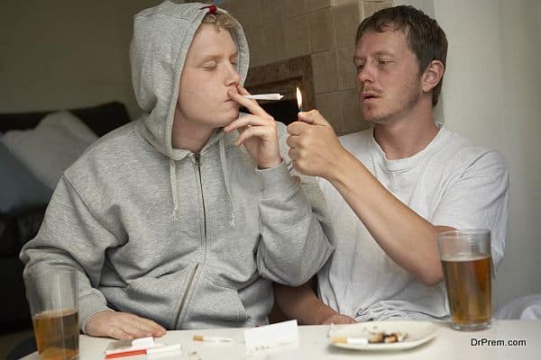 Man smoking marijuana with friend