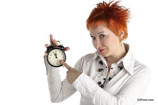 cheerful business woman with clock. Planning and organization co