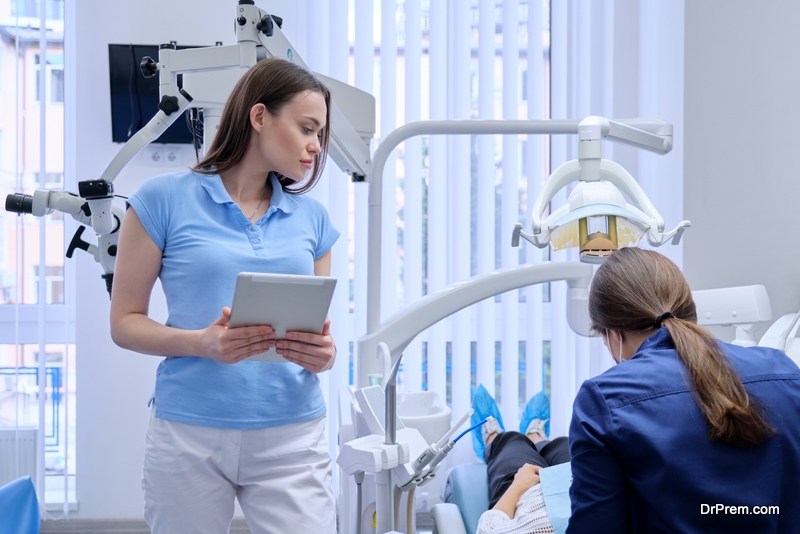 Portrait of dentist doctor with digital tablet