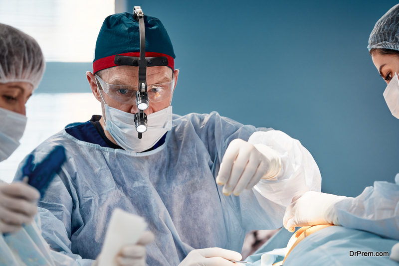 Surgeon assistant feeds coagulator, plastic surgery, professional doctors