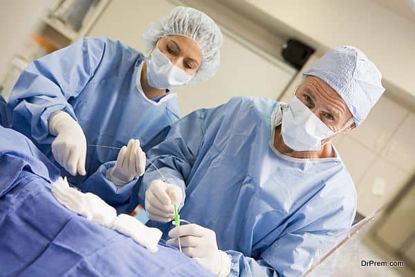 Surgeons Preparing Equipment For Surgery