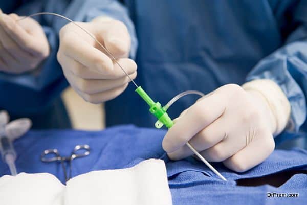 Surgeon Inserting Tube Into Patient During Surgery