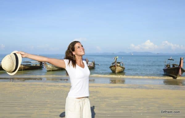 Woman enjoying freedom on Thailand travel at beach