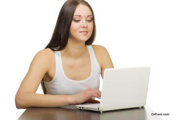 Young woman with laptop isolated