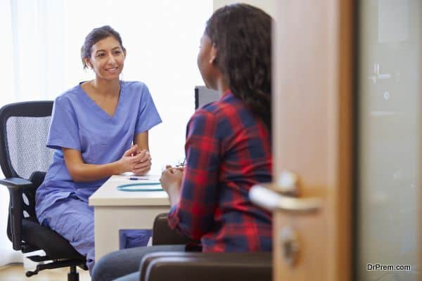 Patient Having Consultation With Female Doctor In Office