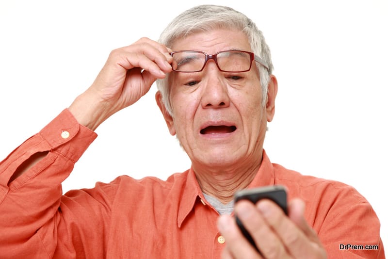 old man suffering from presbyopia